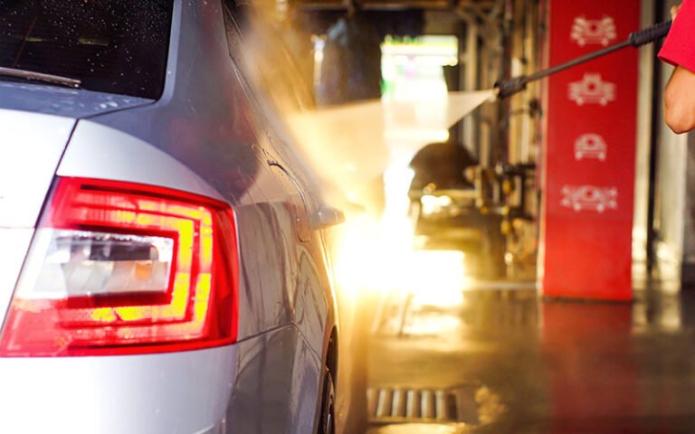 Dashboard view of SiteWatch Web showing real-time car wash performance metrics on a computer screen