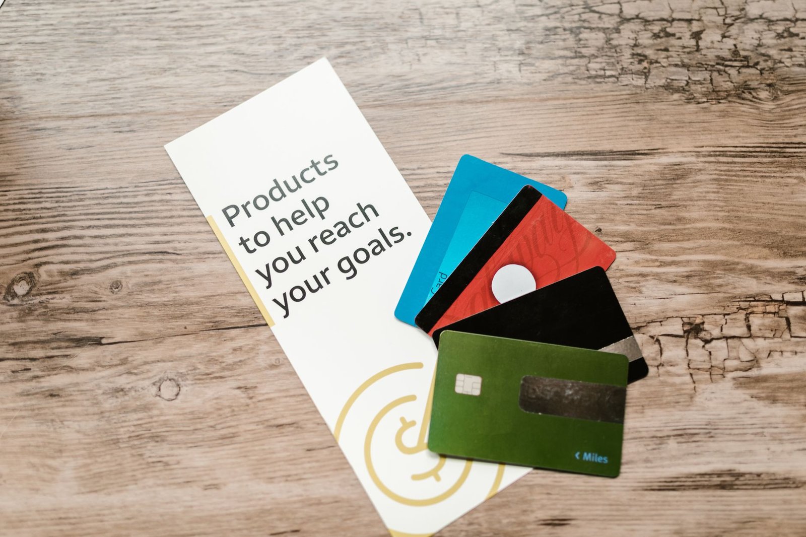 A collection of premium credit cards fanned out on a table, symbolizing a rewards strategy.