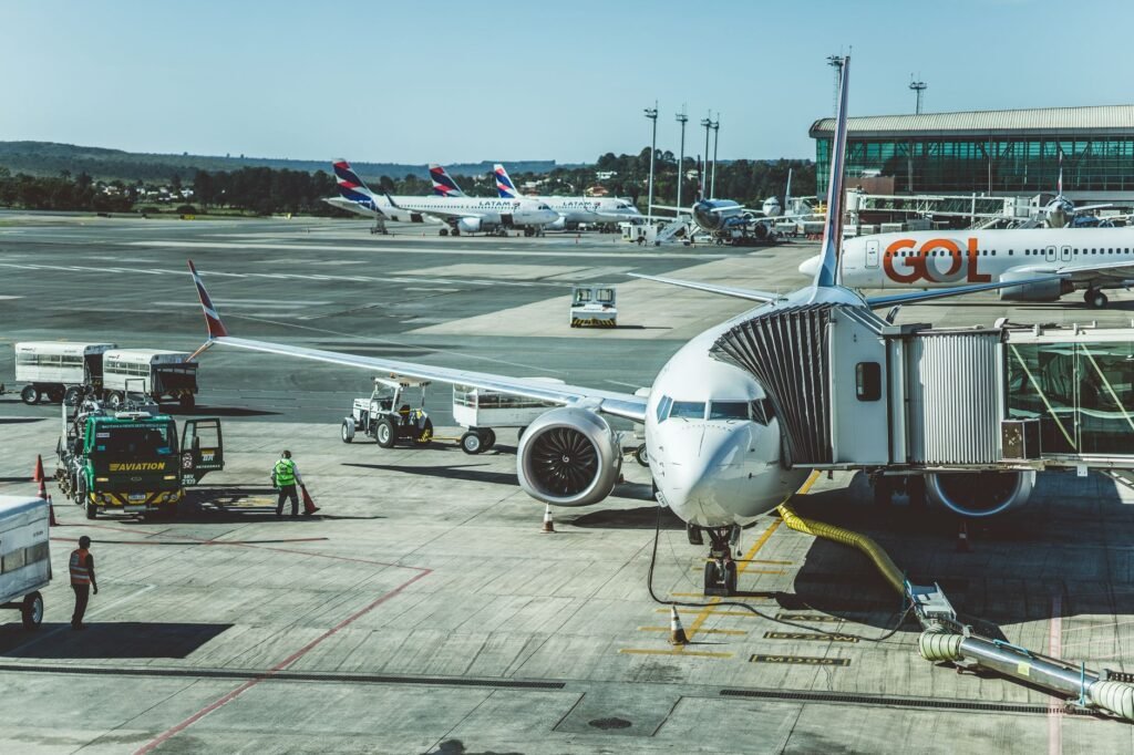 Frontier Airlines plane at an airport gate during summer 2026. practical detail