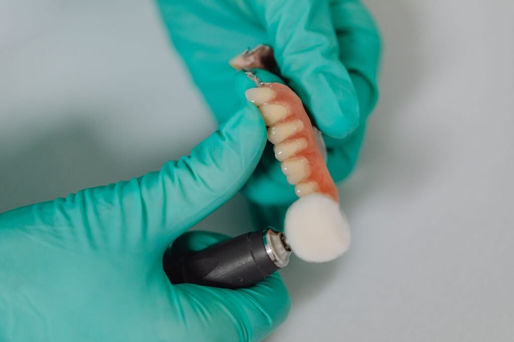 3D printer in a modern dental office creating a tooth restoration, illustrating 2026 dental technology and savings. practical detail