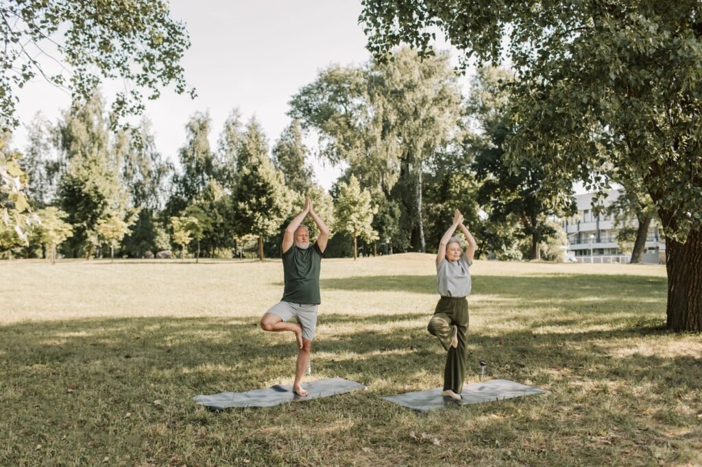 Senior couple practicing longevity habits in a sunny park setting. practical detail