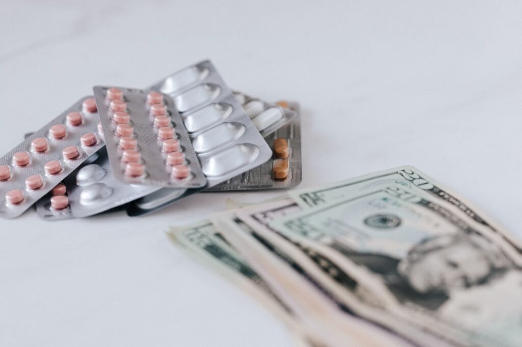 Medicare Part D 2026 guide and prescription bottles on a table. practical detail