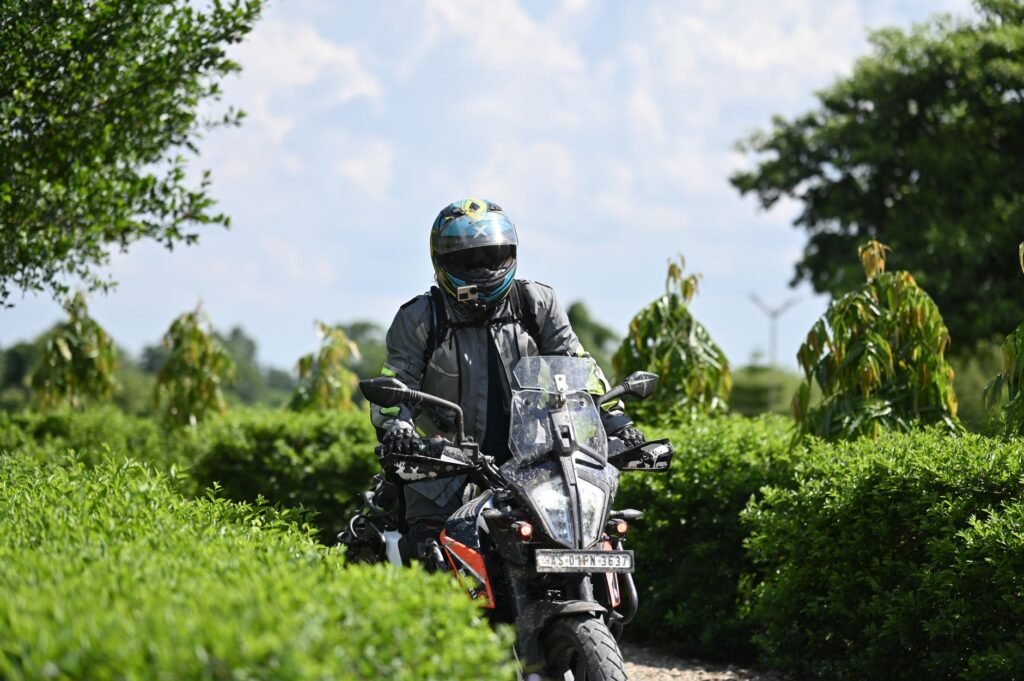 Close-up of a person applying a screen protector to a motorcycle digital dashboard. practical detail