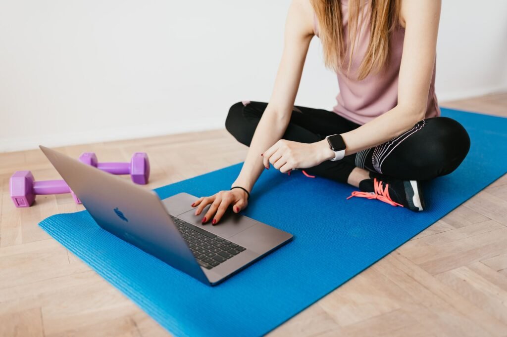 A high-tech smart home gym featuring AI fitness mirrors and robotic resistance equipment in a modern apartment. practical detail