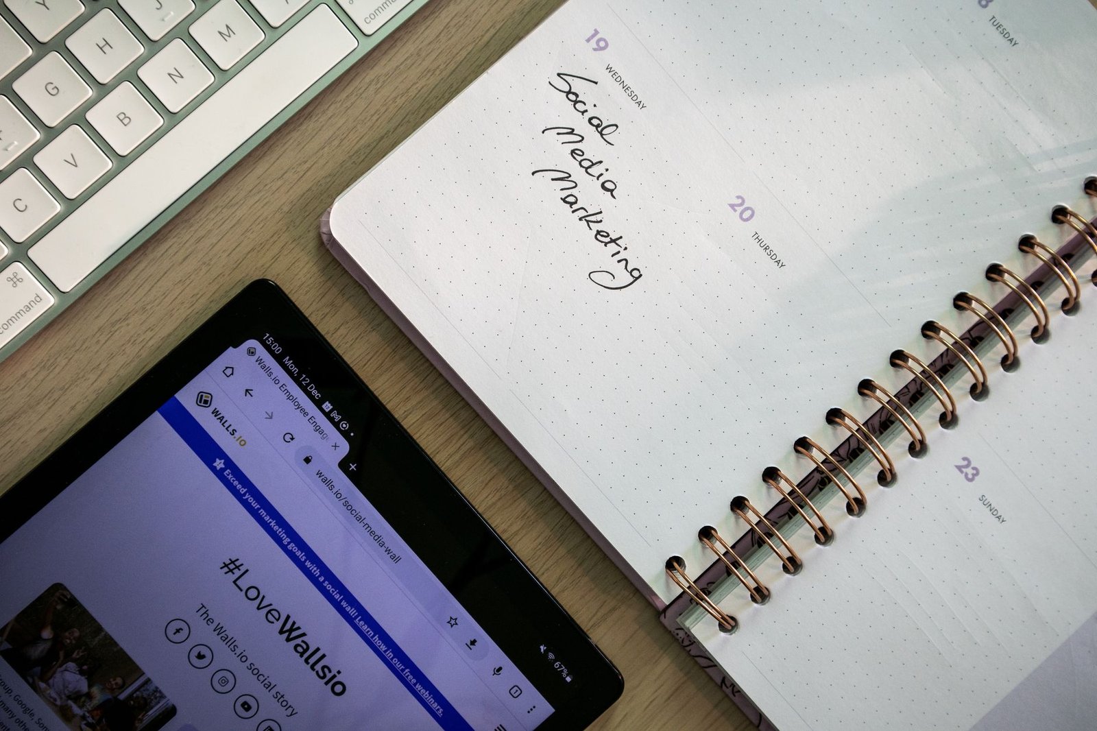 A professional managing a social commerce shop on a smartphone in a modern office environment.