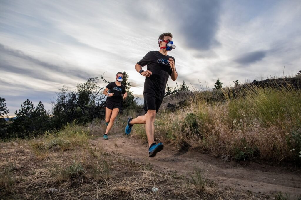 A person training for VO2 max and longevity during a sunrise run. practical detail
