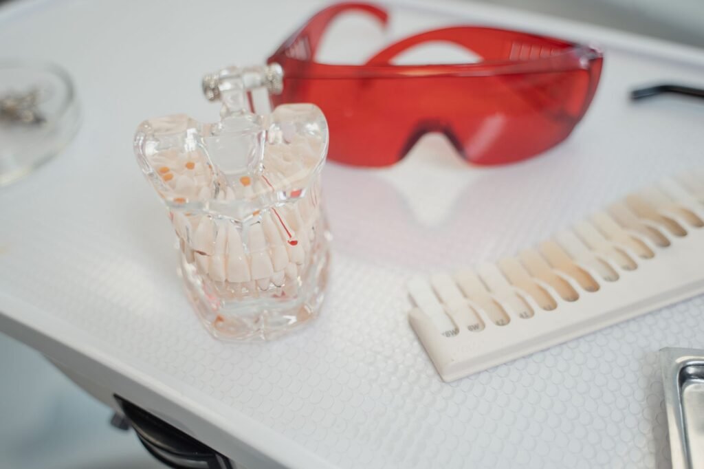 Professional grade 2026 dental tech including an AI toothbrush and intraoral camera on a clean bathroom counter. practical detail