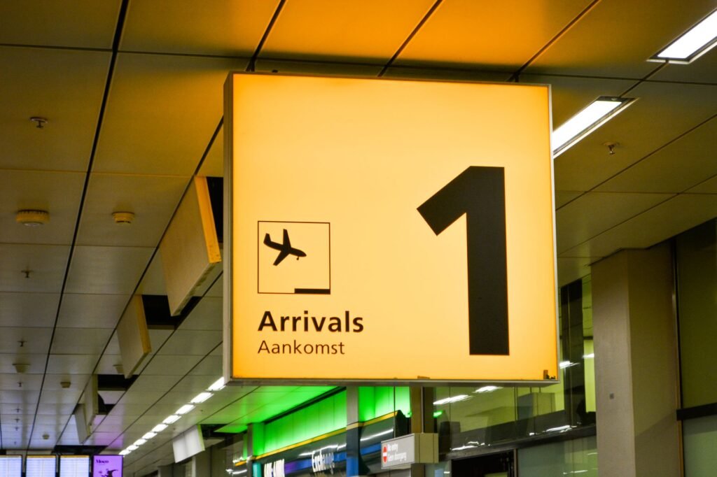 Airport departure board showing canceled flights and a smartphone with a refund notification. practical detail