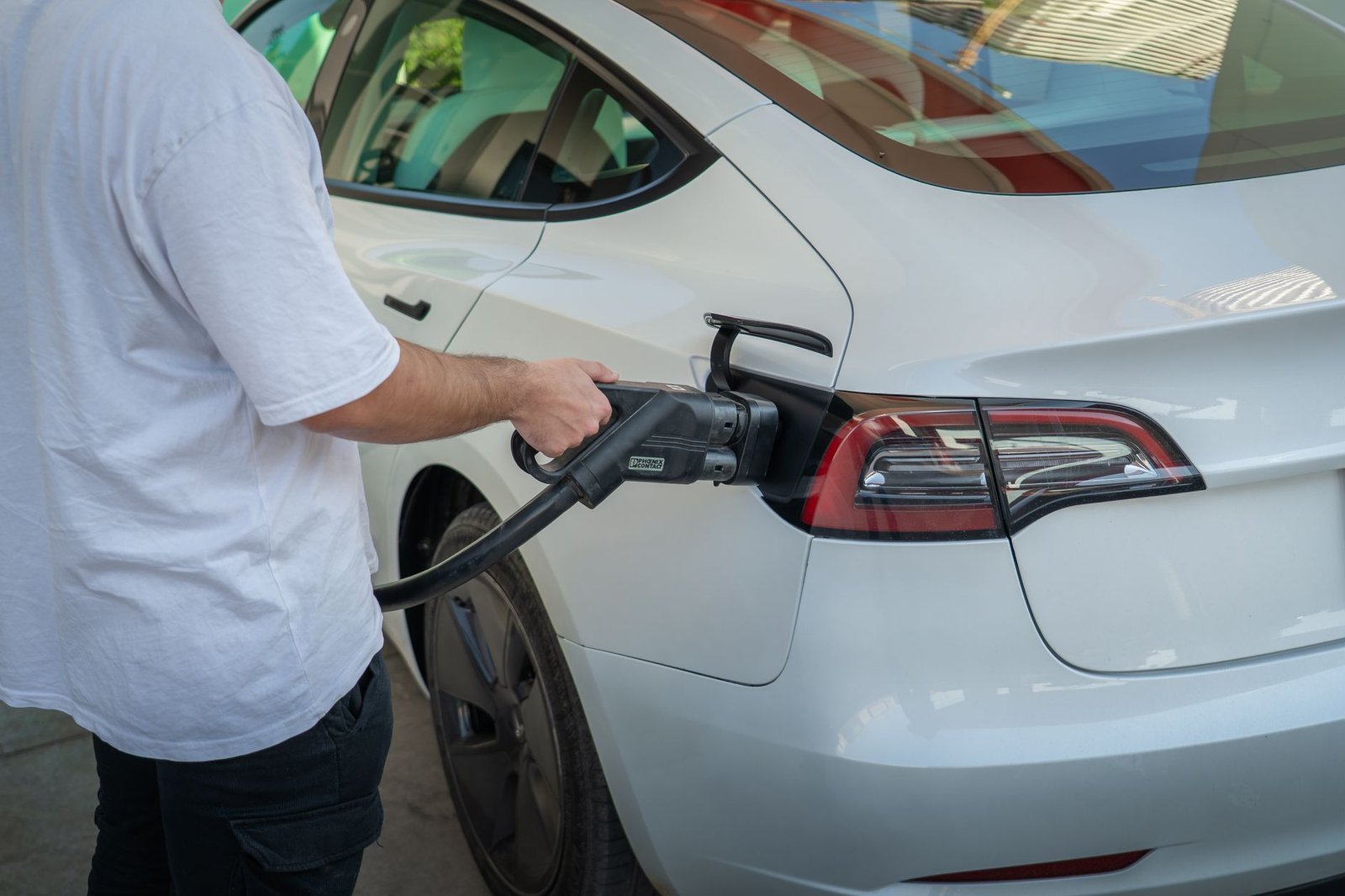 A modern Level 2 EV home charging station installed in a residential garage.
