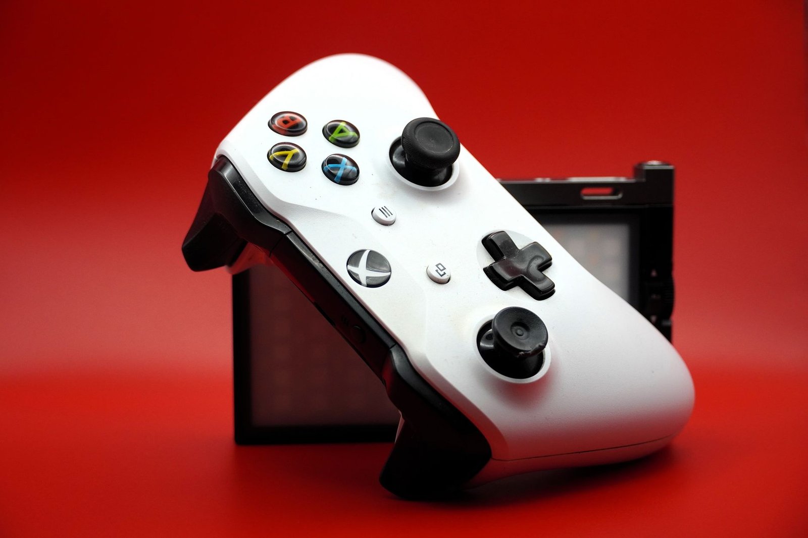 A modern home gaming setup showing a digital library of games on a television screen, representing the Xbox Game Pass August 2026 update.