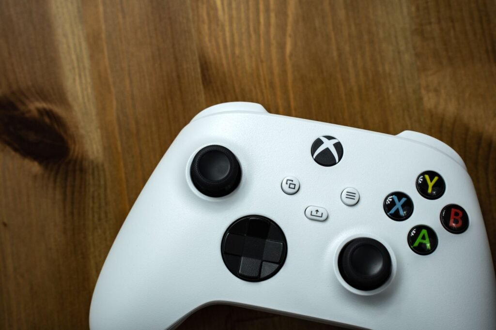 A modern home gaming setup showing a digital library of games on a television screen, representing the Xbox Game Pass August 2026 update. practical detail